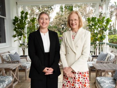 Two women smiling at the camera